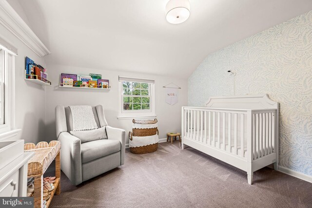3311 Cameron Mills Rd, Alexandria, VA 22302 - carpeted bedroom with lofted ceiling, a nursery area, and baseboards