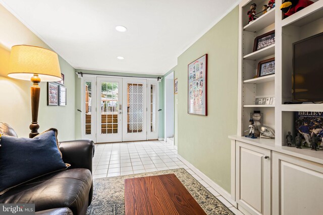 3311 Cameron Mills Rd, Alexandria, VA 22302 - living area featuring french doors, baseboards, light tile patterned floors, built in shelves, and recessed lighting