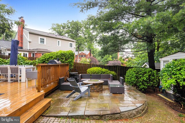 3311 Cameron Mills Rd, Alexandria, VA 22302 - wooden deck with a fire pit, a fenced backyard, and a patio