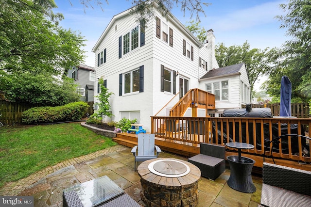 3311 Cameron Mills Rd, Alexandria, VA 22302 - rear view of house with a fire pit, a patio area, a wooden deck, and a chimney