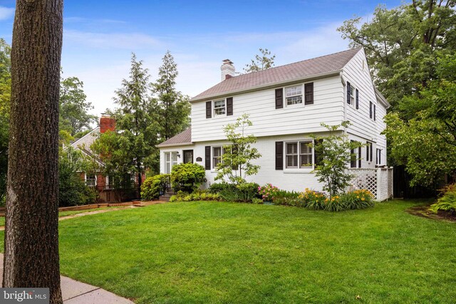 3311 Cameron Mills Rd, Alexandria, VA 22302 - colonial home with a chimney and a front lawn