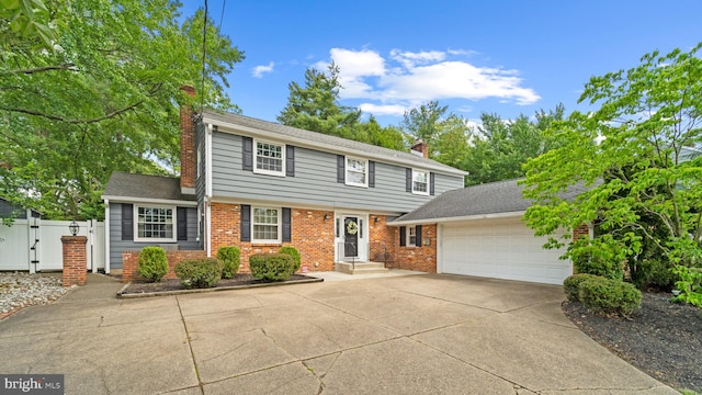 130 Pearl Croft Rd, Cherry Hill, NJ 08034 - colonial inspired home with a chimney, an attached garage, concrete driveway, and a gate