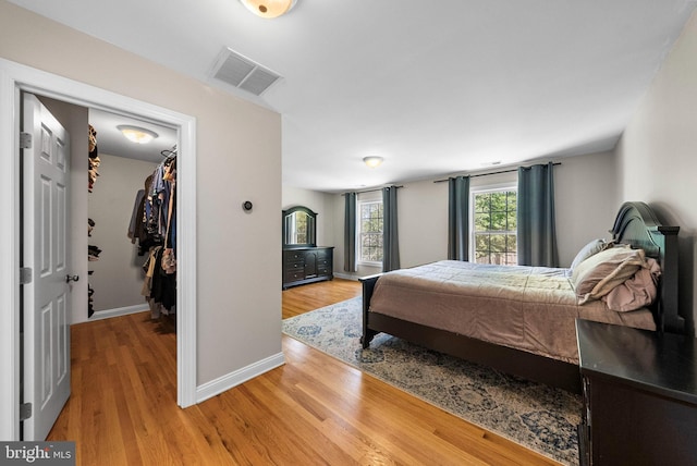 143 Oak St, Bridgewater, NJ 08807 - bedroom featuring a spacious closet, light wood-style floors, baseboards, and a closet
