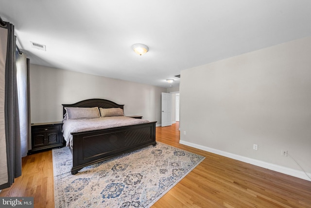 143 Oak St, Bridgewater, NJ 08807 - bedroom with light wood-style flooring and baseboards
