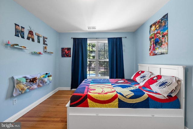 143 Oak St, Bridgewater, NJ 08807 - bedroom with wood finished floors and baseboards