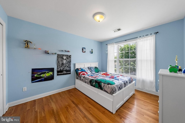 143 Oak St, Bridgewater, NJ 08807 - bedroom with light wood-style floors and baseboards
