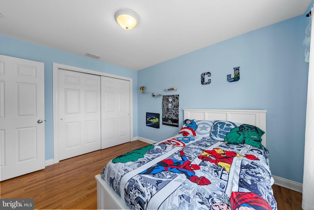 143 Oak St, Bridgewater, NJ 08807 - bedroom with wood finished floors, baseboards, and a closet