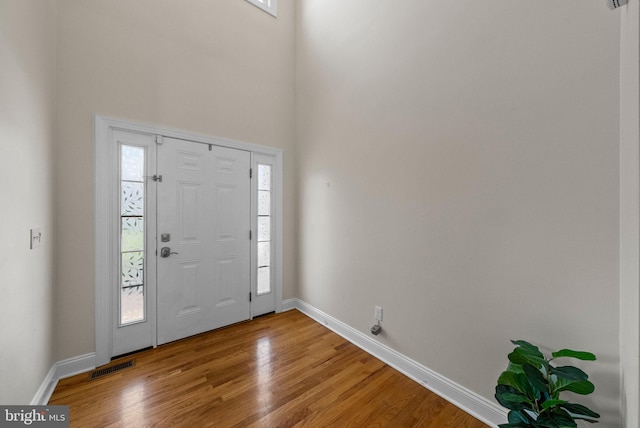 143 Oak St, Bridgewater, NJ 08807 - entrance foyer featuring plenty of natural light, light wood-style floors, baseboards, and a high ceiling