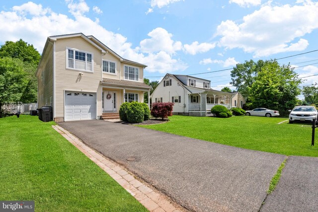 143 Oak St, Bridgewater, NJ 08807 - traditional home with an attached garage, a front lawn, covered porch, and asphalt driveway