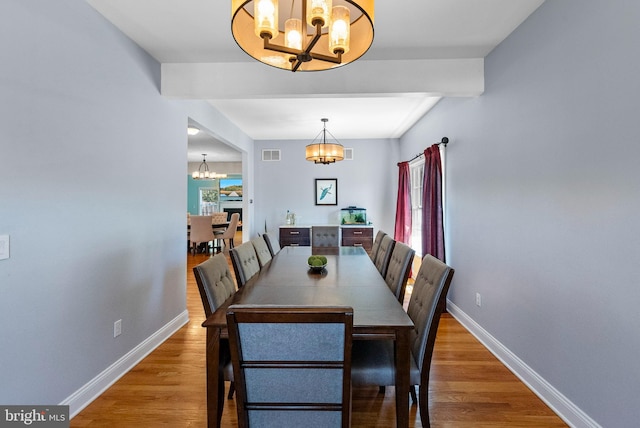143 Oak St, Bridgewater, NJ 08807 - dining space with a chandelier, baseboards, wood finished floors, and beamed ceiling