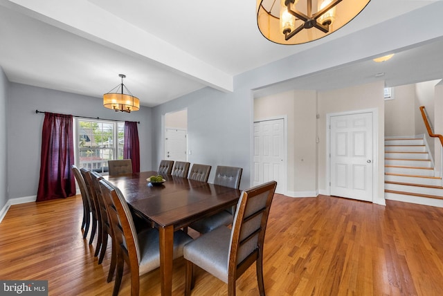 143 Oak St, Bridgewater, NJ 08807 - dining area featuring a chandelier, stairway, light wood-style flooring, baseboards, and beam ceiling