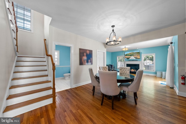 143 Oak St, Bridgewater, NJ 08807 - dining space with wood finished floors, stairs, baseboards, and a chandelier