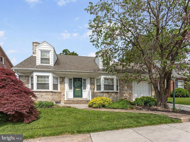 218 Main St N, Spring Grove, PA 17362 - view of front of home with stone siding, a chimney, a front lawn, and roof with shingles
