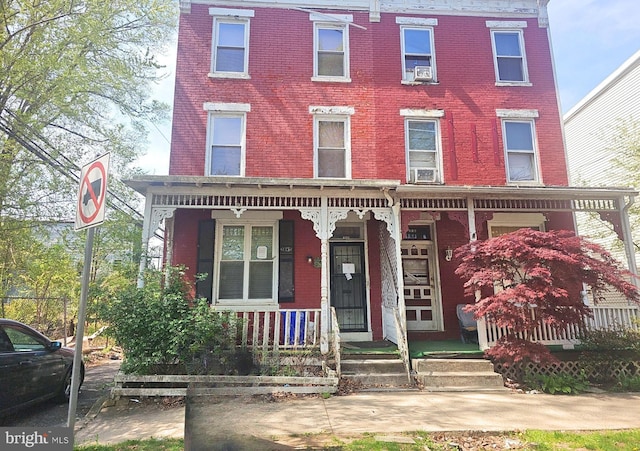 208 N 15th St, Harrisburg, PA 17103 - view of front of home with covered porch and brick siding