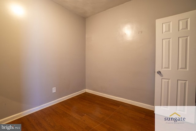 1210 Sargeant St, Baltimore, MD 21223 - empty room with dark wood finished floors and baseboards