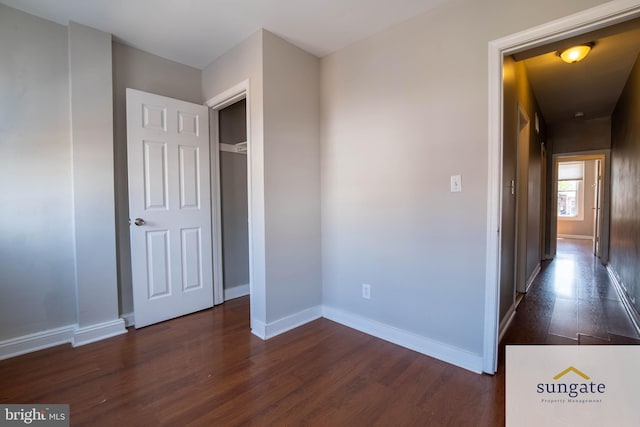 1210 Sargeant St, Baltimore, MD 21223 - unfurnished bedroom with dark wood finished floors and baseboards