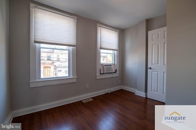 1210 Sargeant St, Baltimore, MD 21223 - empty room with dark wood-type flooring and cooling unit