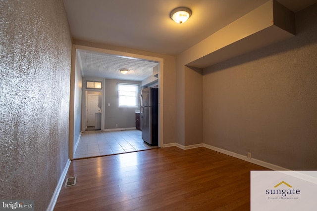 1210 Sargeant St, Baltimore, MD 21223 - hall featuring wood finished floors and baseboards