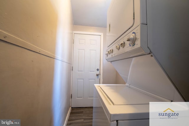 1210 Sargeant St, Baltimore, MD 21223 - laundry area featuring stacked washer and clothes dryer and dark wood-type flooring