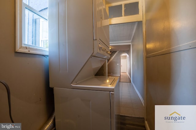 1210 Sargeant St, Baltimore, MD 21223 - laundry area with stacked washer and clothes dryer and arched walkways