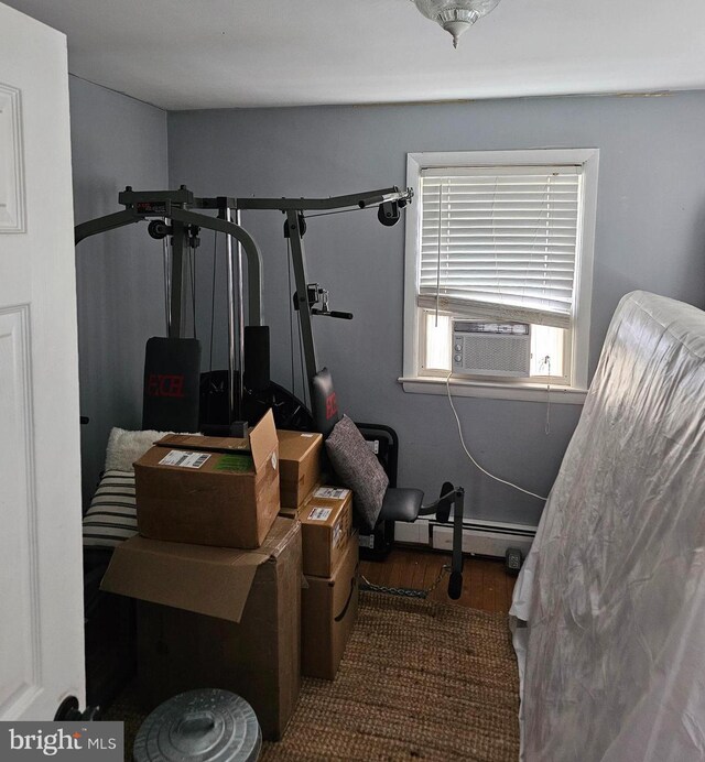 102 Northside Rd, Elverson, PA 19520 - exercise area with cooling unit, wood finished floors, and a baseboard heating unit