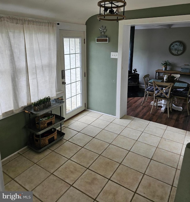 102 Northside Rd, Elverson, PA 19520 - tiled dining room with a wood stove