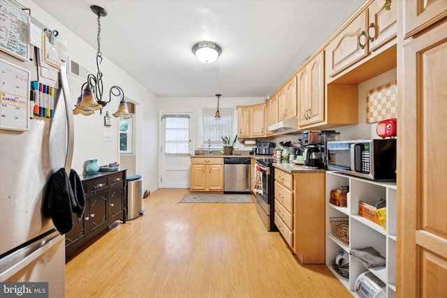 2722 E Riding Dr, Wilmington, DE 19808 - kitchen featuring appliances with stainless steel finishes, light brown cabinets, light wood-type flooring, decorative light fixtures, and under cabinet range hood
