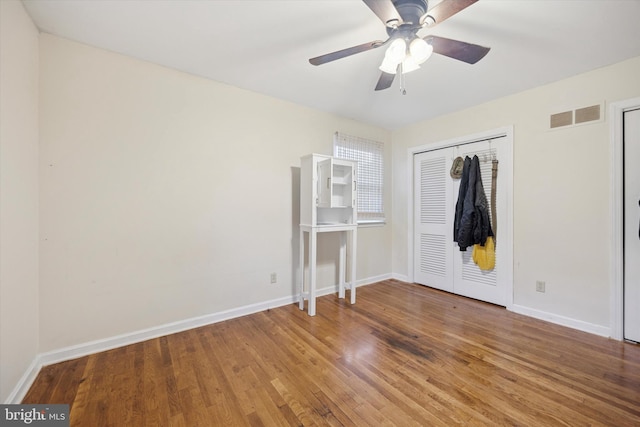 2722 E Riding Dr, Wilmington, DE 19808 - unfurnished bedroom featuring wood finished floors, baseboards, and ceiling fan