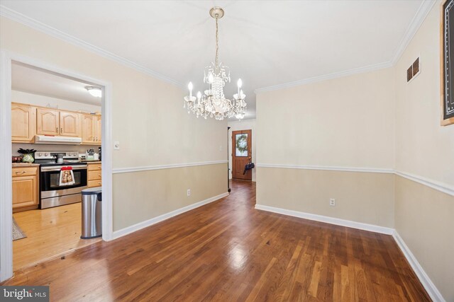 2722 E Riding Dr, Wilmington, DE 19808 - unfurnished dining area with wood finished floors, a chandelier, ornamental molding, and baseboards