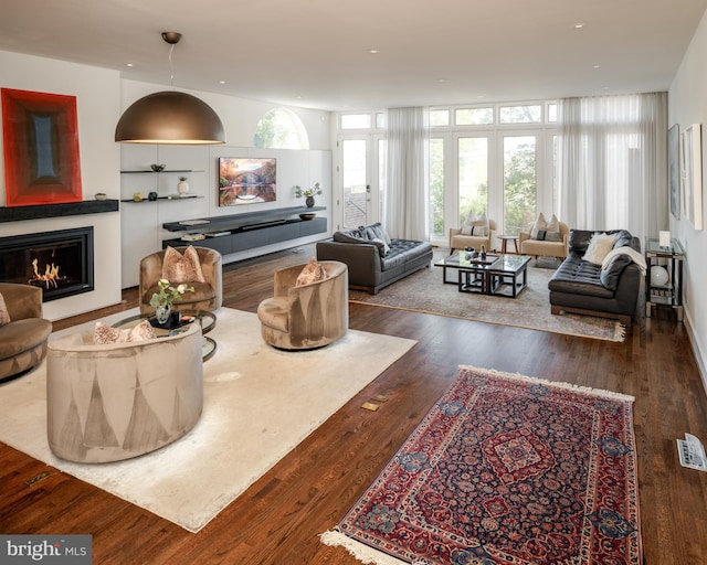 1914 35th St NW, Washington, DC 20007 - living area with a glass covered fireplace, wood finished floors, and recessed lighting