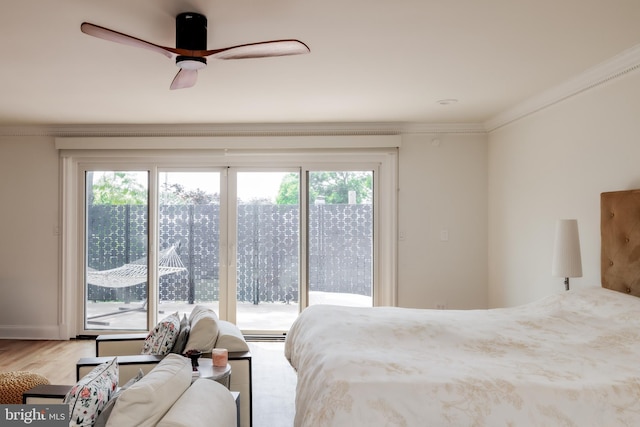 1914 35th St NW, Washington, DC 20007 - bedroom with access to exterior, multiple windows, ornamental molding, and wood finished floors