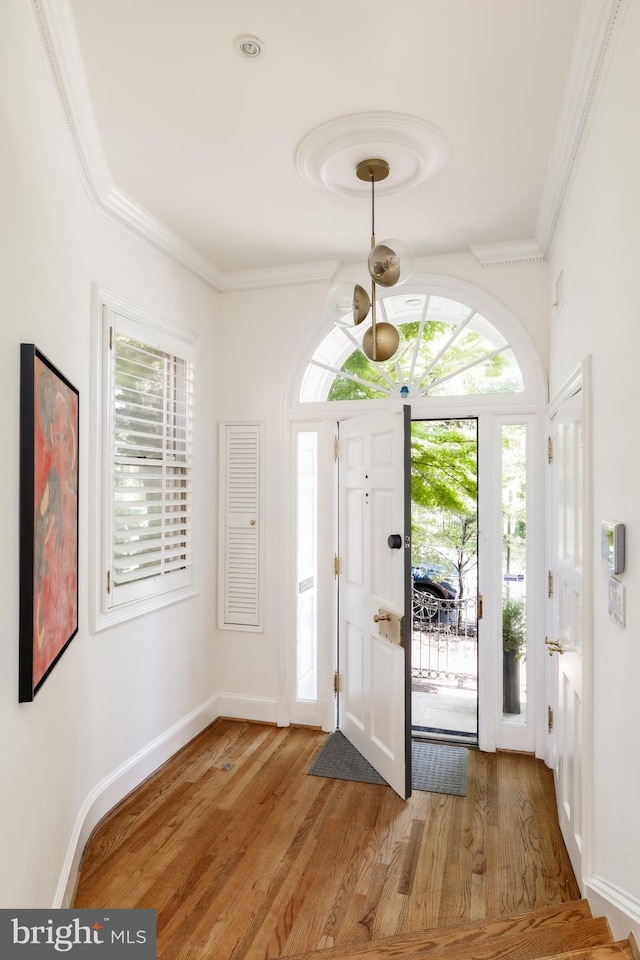 1914 35th St NW, Washington, DC 20007 - foyer with light wood-style flooring and crown molding