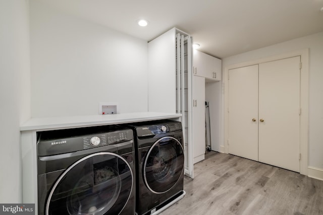 1914 35th St NW, Washington, DC 20007 - laundry area featuring washer and dryer, light wood-type flooring, and recessed lighting
