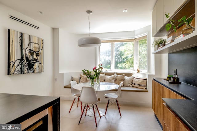 1914 35th St NW, Washington, DC 20007 - dining room featuring wine cooler and baseboards
