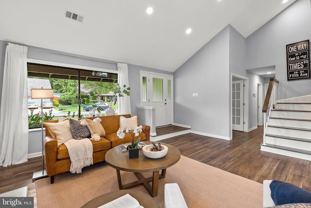 4431 Flintstone Rd, Alexandria, VA 22306 - living area with wood finished floors, baseboards, recessed lighting, stairs, and high vaulted ceiling
