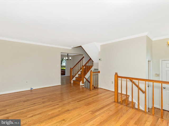 20313 Cedarhurst Way, Germantown, MD 20876 - empty room with light wood-style flooring, a chandelier, ornamental molding, and stairway