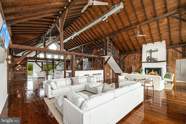 820 Spring Hill Rd, Riegelsville, PA 18077 - living room with wooden walls, high vaulted ceiling, hardwood / wood-style floors, a ceiling fan, and wood ceiling with exposed beams