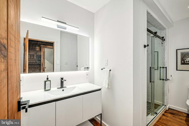 820 Spring Hill Rd, Riegelsville, PA 18077 - full bathroom featuring toilet, vanity, a stall shower, wood finished floors, and baseboards