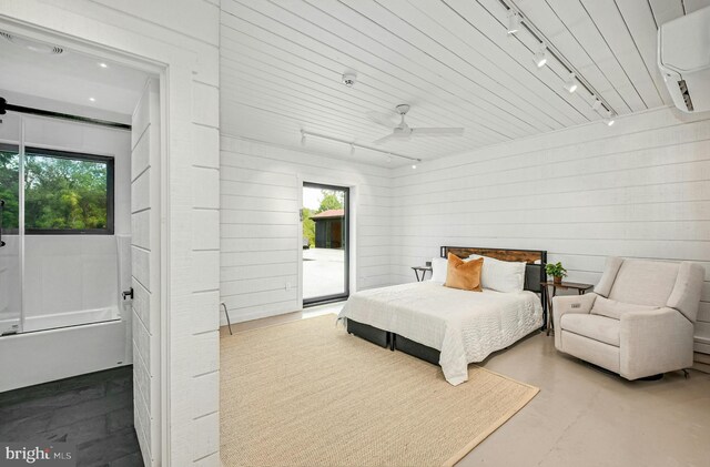 820 Spring Hill Rd, Riegelsville, PA 18077 - bedroom featuring rail lighting, access to exterior, multiple windows, ceiling fan, and wooden walls