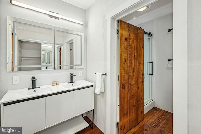 820 Spring Hill Rd, Riegelsville, PA 18077 - bathroom featuring wood finished floors, double vanity, and a shower stall