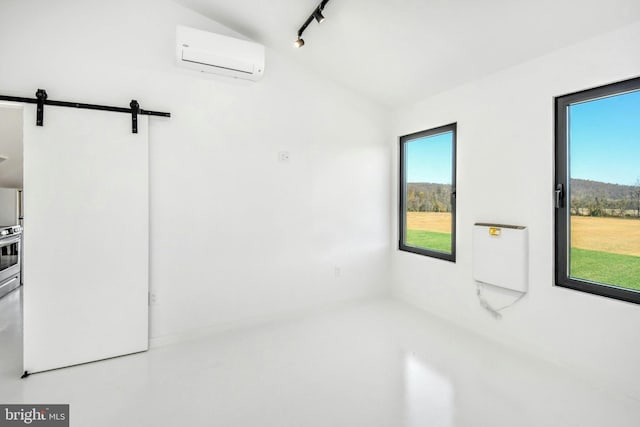 820 Spring Hill Rd, Riegelsville, PA 18077 - empty room featuring an AC wall unit, lofted ceiling, and a barn door