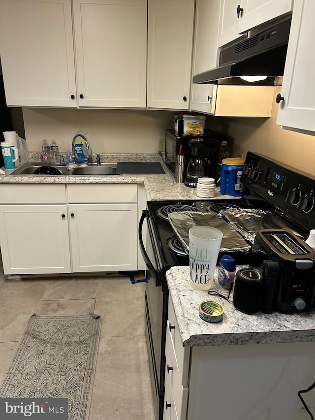 581 Old Limekiln Ln, Newport, PA 17074 - kitchen featuring under cabinet range hood, black stove, white cabinetry, and a sink