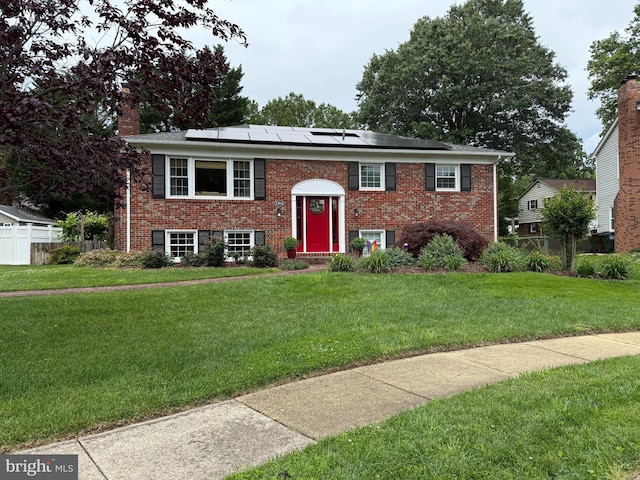 5704 Shropshire Ct, Alexandria, VA 22315 - split foyer home with solar panels, a chimney, and brick siding