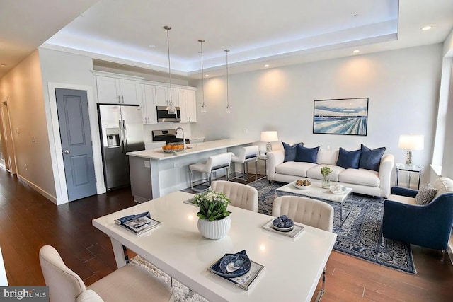 1337 N Franklin St, Philadelphia, PA 19122 - dining space featuring a raised ceiling, dark wood-type flooring, recessed lighting, and baseboards