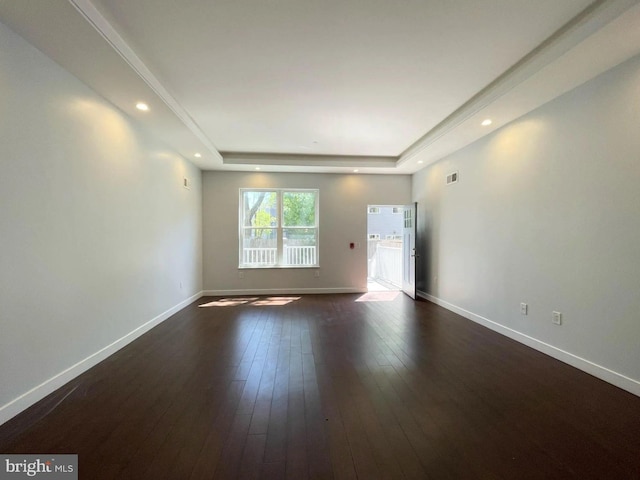 1337 N Franklin St, Philadelphia, PA 19122 - empty room with a raised ceiling, dark wood finished floors, baseboards, and recessed lighting