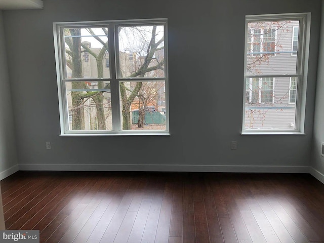 1337 N Franklin St, Philadelphia, PA 19122 - spare room with plenty of natural light, baseboards, and dark wood-style floors