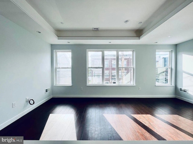 1337 N Franklin St, Philadelphia, PA 19122 - unfurnished room featuring a raised ceiling, dark wood-type flooring, and baseboards