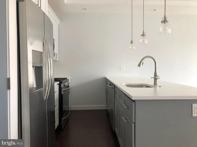 1337 N Franklin St, Philadelphia, PA 19122 - kitchen featuring stainless steel appliances, a sink, a peninsula, light countertops, and gray cabinetry