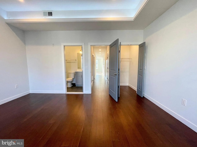 1337 N Franklin St, Philadelphia, PA 19122 - unfurnished bedroom with dark wood-style floors, a spacious closet, baseboards, and connected bathroom