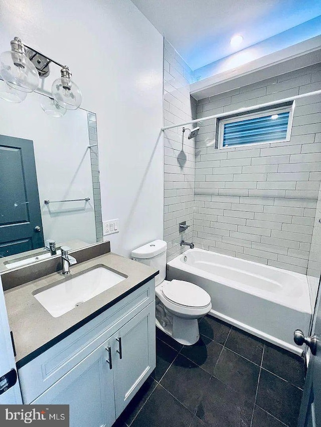 1337 N Franklin St, Philadelphia, PA 19122 - full bath with vanity, washtub / shower combination, toilet, and tile patterned floors